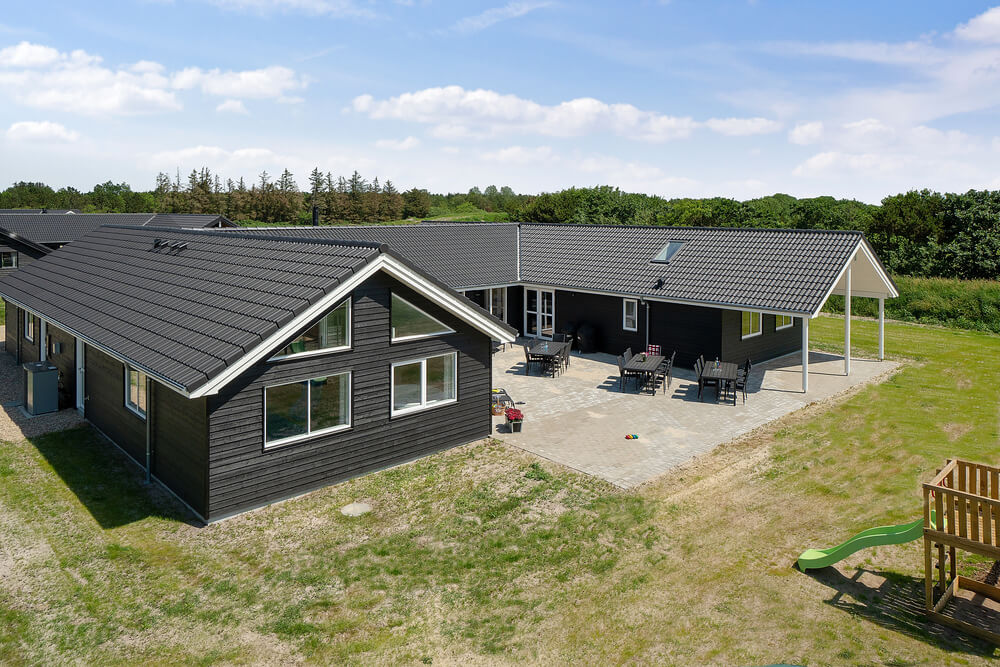 Dette lekre huset med svømmebasseng, nr. 461, med plass til 24 personer, ligger i Vestjylland