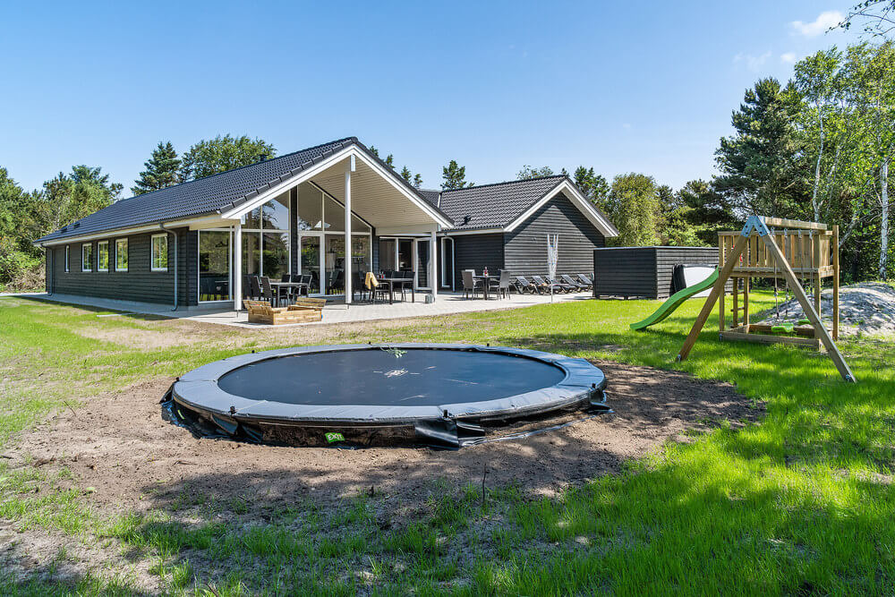Dette lekre huset med svømmebasseng, nr. 498, med plass til 18 personer, ligger i Vestjylland
