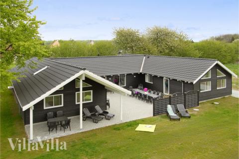 Dette lekre huset med svømmebasseng, nr. 284, med plass til 20 personer, ligger i Fyn og øyer