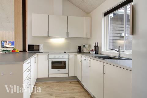 Kjøkkenet i luksushus nr. 310 er fullt utstyrt så dere lett kan lage mat til 16 personer.