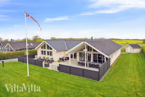 Dette lekre huset med svømmebasseng, nr. 315, med plass til 18 personer, ligger i Fyn og øyer