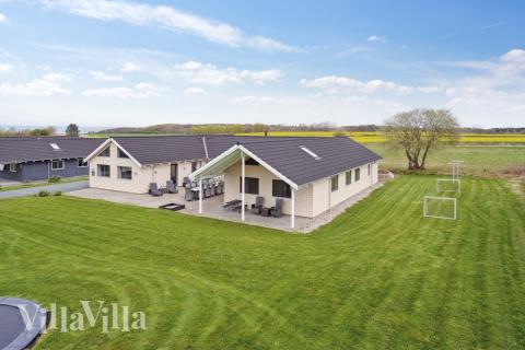 Dette lekre huset med svømmebasseng, nr. 318, med plass til 22 personer, ligger i Fyn og øyer