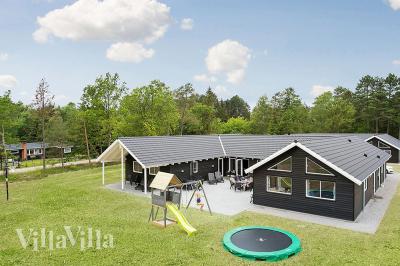 Dette lekre huset med svømmebasseng, nr. 346, med plass til 22 personer, ligger i Nordsjælland