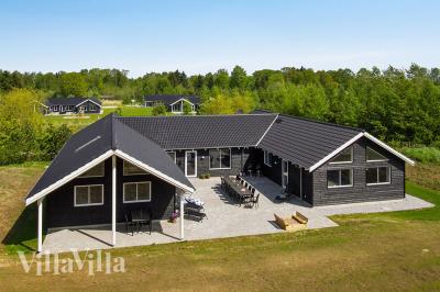 Dette lekre huset med svømmebasseng, nr. 394, med plass til 22 personer, ligger i Østjylland