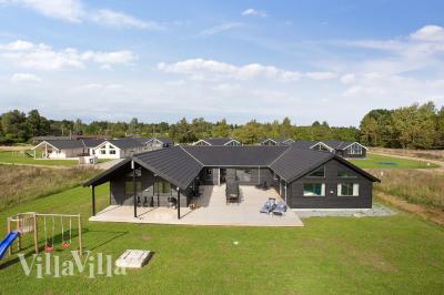 Dette lekre huset med svømmebasseng, nr. 395, med plass til 20 personer, ligger i Nordsjælland