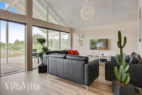 Oppholdsrom med plass til 18 i luksushus nr. 390.