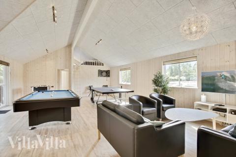 Konkurrer i feriehusets aktivitetsrom når dere besøker luksushus nr. 406 i Nordsjælland.