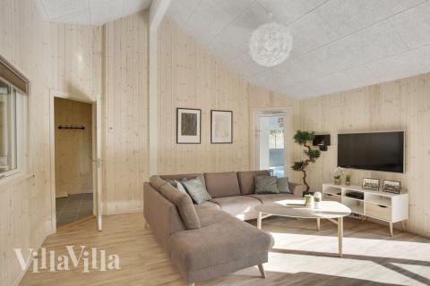 Det er god plass til at 24 personer sitter sammen i feriehusets oppholdsrom under et besøk i luksushus 406 i Nordsjælland.