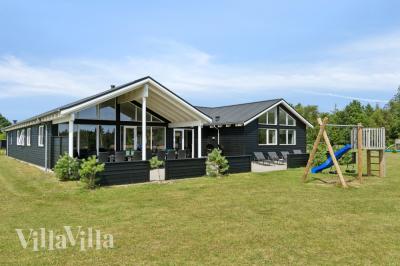 Dette lekre huset med svømmebasseng, nr. 408, med plass til 18 personer, ligger i Nordjylland
