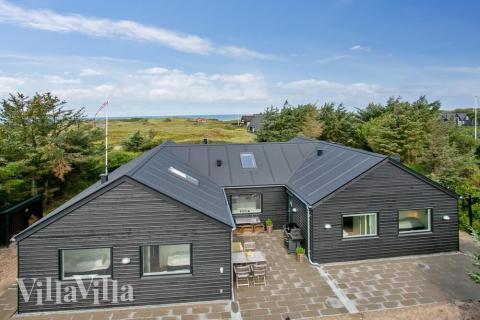 Dette lekre huset med svømmebasseng, nr. 411, med plass til 14 personer, ligger i Nordjylland