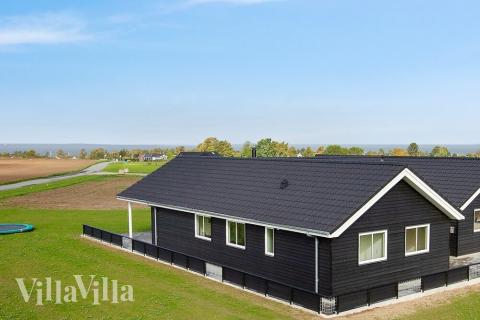 Dette lekre huset med svømmebasseng, nr. 424, med plass til 14 personer, ligger i Fyn og øyer
