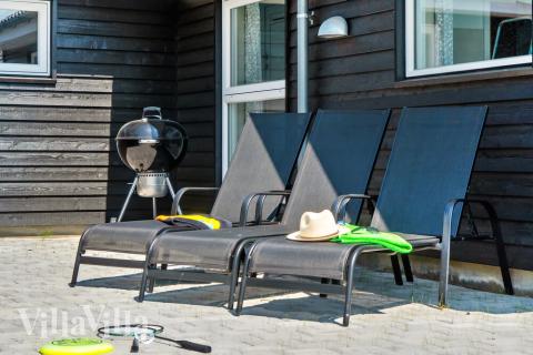 Nyt en grillkveld på terrassen i luksushus nr. 427 i Lolland/Falster/Møn