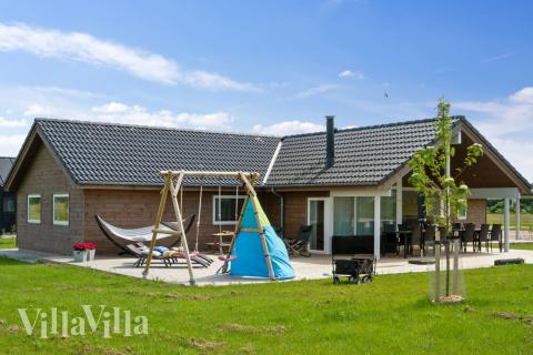 Dette lekre huset med spa, nr. 443, med plass til 10 personer, ligger i Østjylland