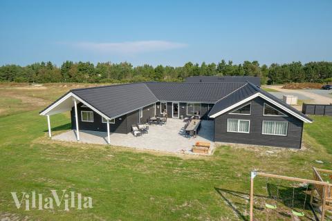 Dette lekre huset med svømmebasseng, nr. 457, med plass til 20 personer, ligger i Vestjylland