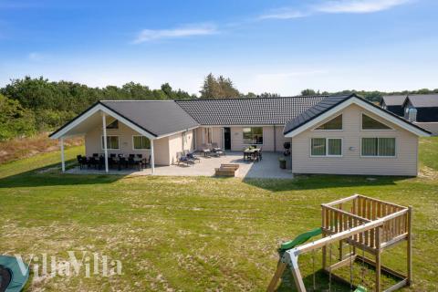 Dette lekre huset med svømmebasseng, nr. 463, med plass til 20 personer, ligger i Vestjylland