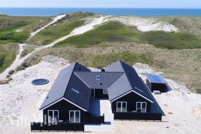 Dette lekre huset med svømmebasseng, nr. 486, med plass til 20 personer, ligger i Vestjylland