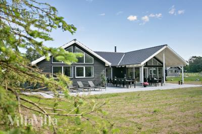 Dette lekre huset med svømmebasseng, nr. 726, med plass til 18 personer, ligger i Tyskland