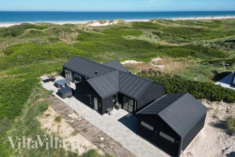 Dette lekre huset med svømmebasseng, nr. 514, med plass til 10 personer, ligger i Nordjylland