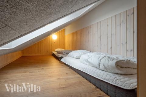 Noen av de 14 soveplassene i luksushus nr. 544 finnes på hems