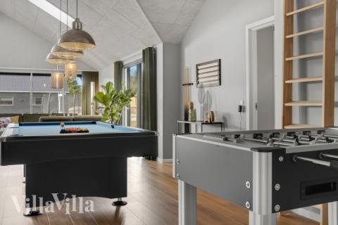 Konkurrer i feriehusets aktivitetsrom når dere besøker luksushus nr. 554 i Vestjylland.