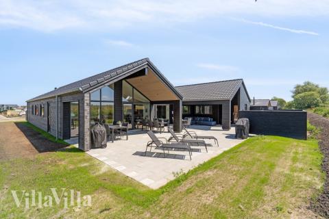 Dette lekre huset med svømmebasseng, nr. 618, med plass til 16 personer, ligger i Fyn og øyer