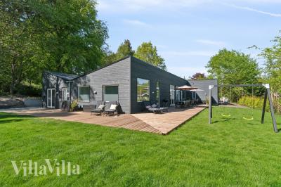 Dette lekre huset med svømmebasseng, nr. 641, med plass til 22 personer, ligger i Nordsjælland
