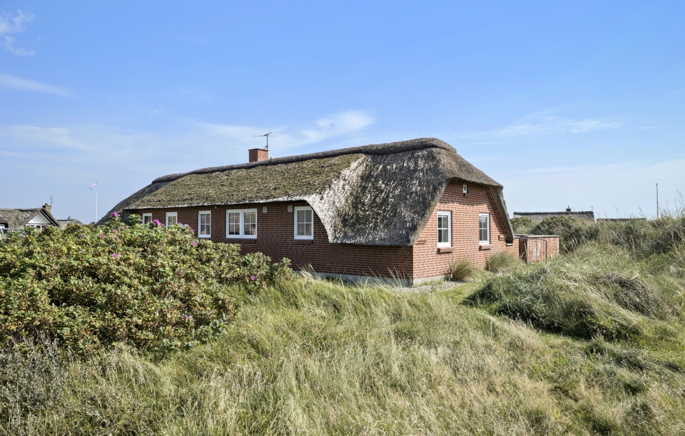 Dette lekre huset med svømmebasseng, nr. 675, med plass til 15 personer, ligger i Vestjylland