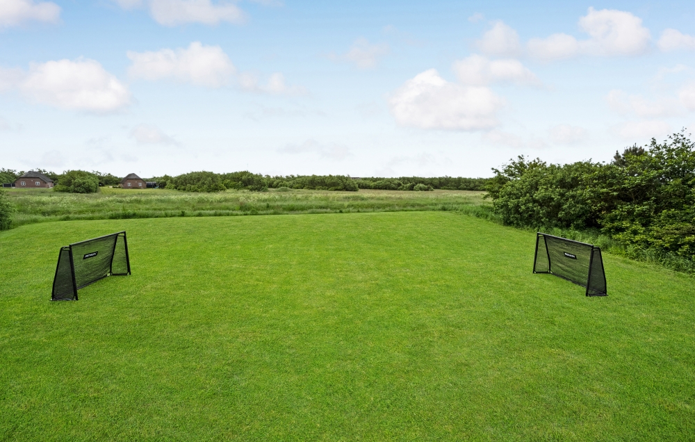 Dette lekre huset med svømmebasseng, nr. 677, med plass til 16 personer, ligger i Vestjylland