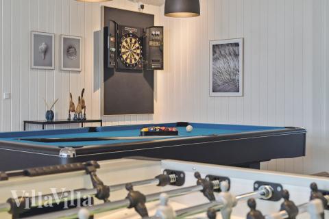 Konkurrer i feriehusets aktivitetsrom når dere besøker luksushus nr. 652 i Nordjylland.