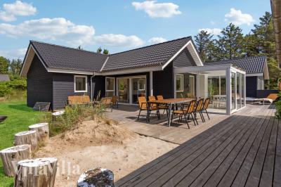 Dette lekre huset med spa, nr. 691, med plass til 10 personer, ligger i Nordjylland