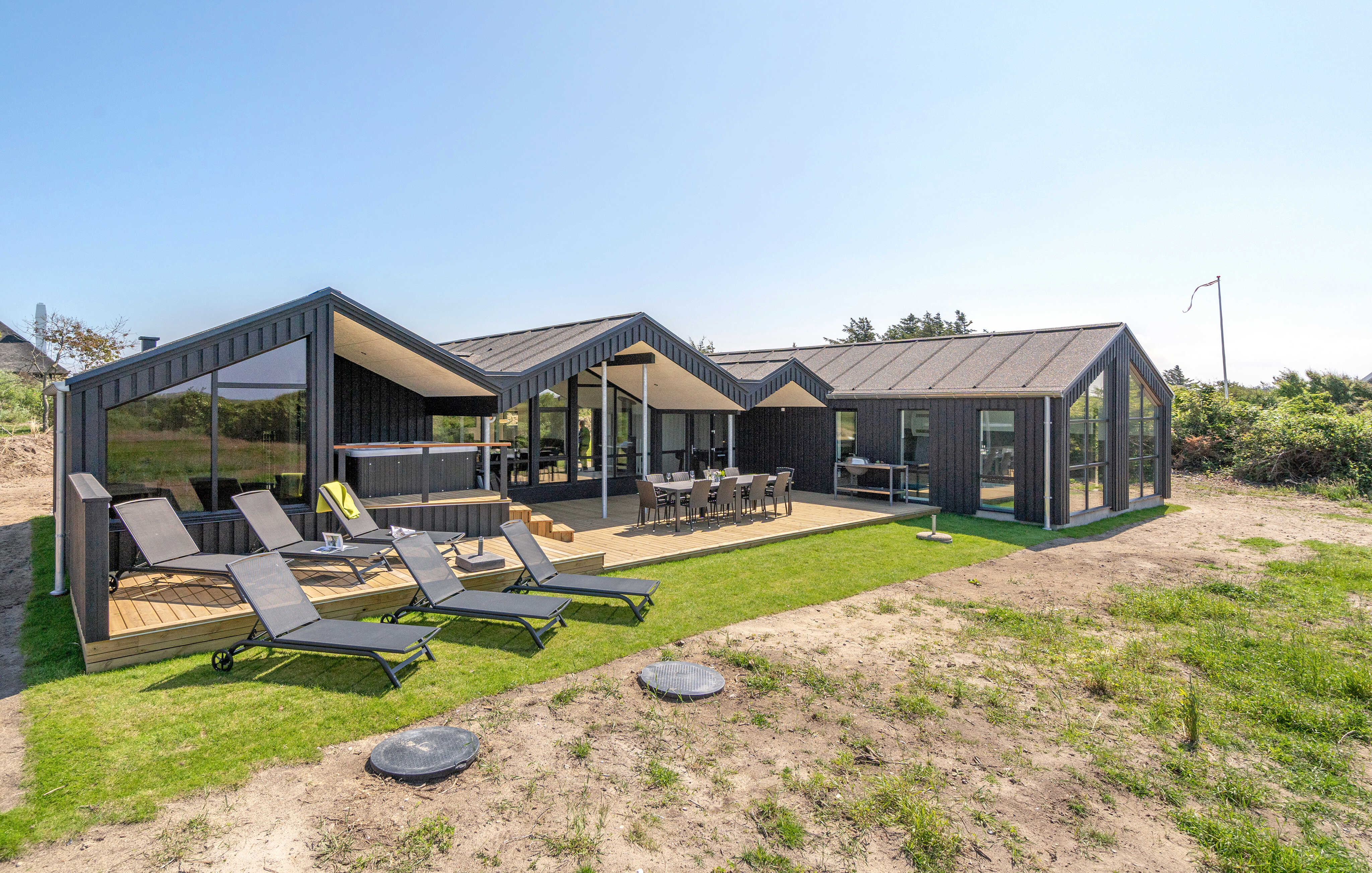 Dette lekre huset med svømmebasseng, nr. 909, med plass til 12 personer, ligger i Nordjylland