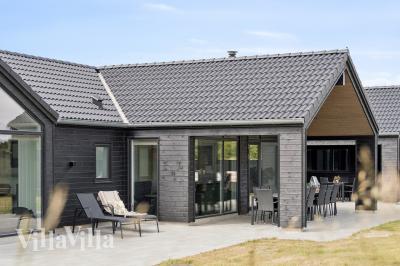 Dette lekre huset med svømmebasseng, nr. 610, med plass til 18 personer, ligger i Vestjylland