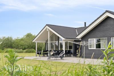 Dette lekre huset med svømmebasseng, nr. 459, med plass til 16 personer, ligger i Lolland/Falster/Møn