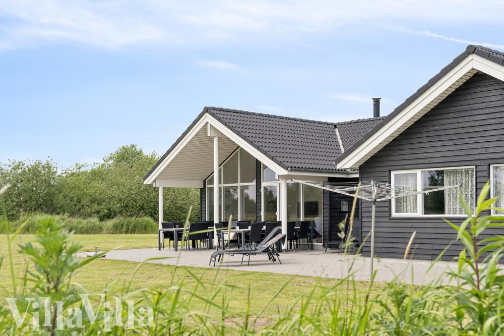 Dette lekre huset med svømmebasseng, nr. 459, med plass til 16 personer, ligger i Lolland/Falster/Møn