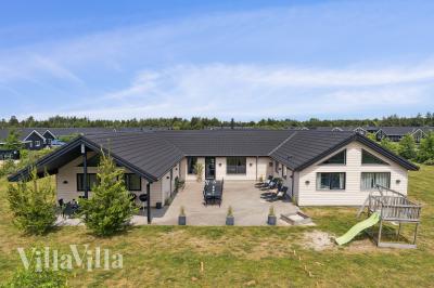 Dette lekre huset med svømmebasseng, nr. 455, med plass til 20 personer, ligger i Vestjylland