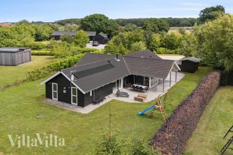 Dette lekre huset med svømmebasseng, nr. 268, med plass til 14 personer, ligger i Østjylland