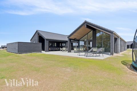 Dette lekre huset med svømmebasseng, nr. 667, med plass til 18 personer, ligger i Fyn og øyer