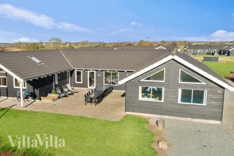 Dette lekre huset med svømmebasseng, nr. 237, med plass til 20 personer, ligger i Sydjylland