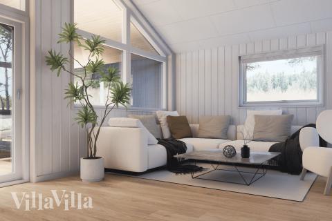 Sofaen i luksushus nr. 919 i Fyn og øyer er perfekt for å hygge seg med et brettspill eller se en film sammen.