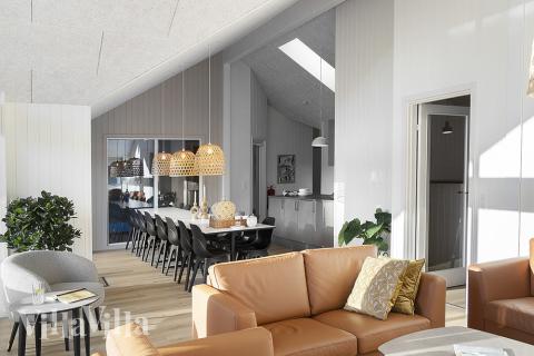 Sofaen i luksushus nr. 802 i Østjylland er perfekt for å hygge seg med et brettspill eller se en film sammen.