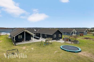 Dette lekre huset med svømmebasseng, nr. 196, med plass til 22 personer, ligger i Nordjylland