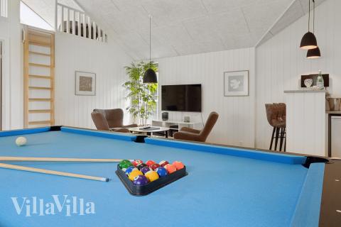 Konkurrer i feriehusets aktivitetsrom når dere besøker luksushus nr. 915 i Fyn og øyer.