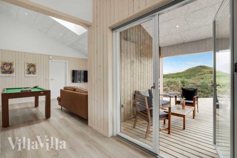 Oppholdsrom med plass til 12 i luksushus nr. 945.