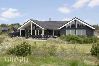Dette lekre huset med svømmebasseng, nr. 456, med plass til 20 personer, ligger i Vestjylland