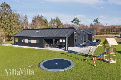 Dette lekre huset med svømmebasseng, nr. 967, med plass til 22 personer, ligger i Østjylland