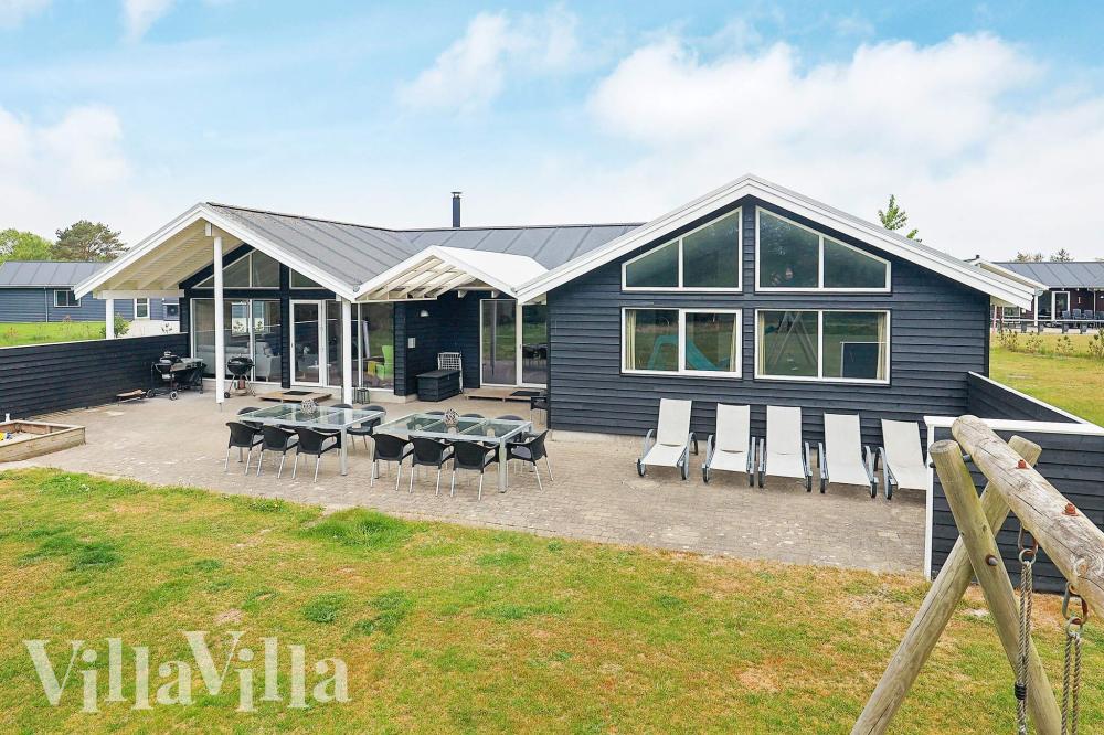 Dette lekre huset med svømmebasseng, nr. 295, med plass til 18 personer, ligger i Nordjylland