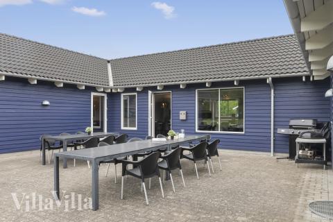 Nyt en grillkveld på terrassen i luksushus nr. 314 i Lolland/Falster/Møn