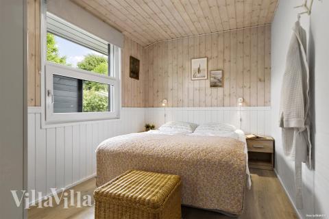 Det er god plass til hygge i feriehusets sofagruppe under oppholdet i luksushus nr. 964