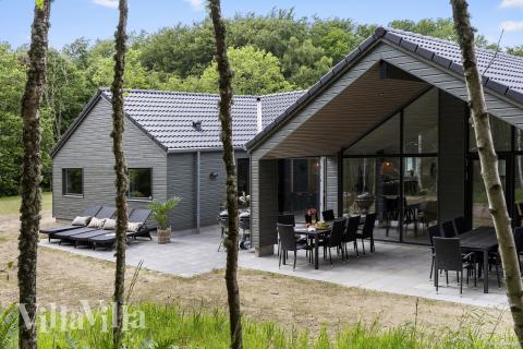 Dette lekre huset med svømmebasseng, nr. 826, med plass til 18 personer, ligger i Østjylland