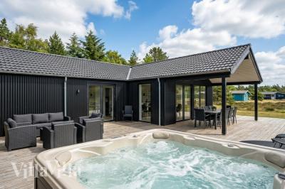 Dette lekre huset med spa, nr. 976, med plass til 14 personer, ligger i Lolland/Falster/Møn